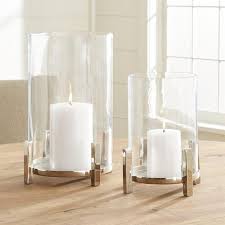 This is a simple glass hurricane candle holders, banded with metal. Grand Glass Silver Metal Hurricane Candle Holder