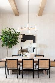 A modern dining area featuring a bar area with white modish bar stools set on the hardwood flooring. Modern Dining Room Ideas For Beautiful Gatherings Jane At Home
