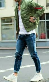 Men S Olive Bomber Jacket White V Neck T Shirt Blue Skinny Jeans White Leather High Top Sneakers White Jeans Men Mens Outfits Men Casual