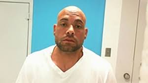 Man found in hotel room with self-inflicted injuries accused of murdering  wife, authorities say