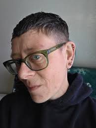 Non-binary person shares new haircut and baked goods