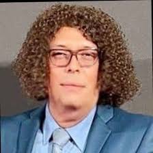 This is Heidi Tompkins, ROI Office Interiors operations specialist,  removing snow from a roof