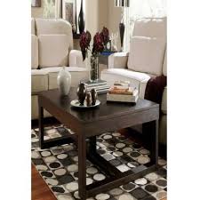Watson coffee table with 1 end table ashley furniture homestore showing off big time with oversized tabletop space the watson coffee table set serves up major contemporary style. The Authenticity Of These New Launches Will Elevate Your Interior Decor With Panache