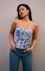 The overbust corset begins below the arm and ends over the hips, while the bust corset begins below the. Blue Renaissance Print Structured Corset Top Prettylittlething