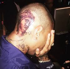 Chris brown reveals new tattoo. Chris Brown Got A Tattoo Of The Venus De Milo On His Head Gq