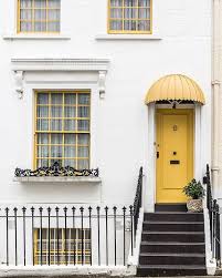 16 Paint Colors That Will Instantly Liven Up Your Home Yellow Doors House Exterior Exterior Design