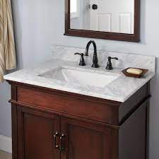 With the patented design of drainage, the cabinet has plenty of storage space for all of your washing items. Home Decorators Collection 25 In W X 19 In D Marble Vanity Top In Carrara With White Single Trough Sink 21108 The Home Depot