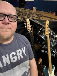 Playing bass and tenor in a small office pit