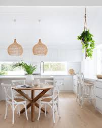 The table is made of rustic douglas fir and has the perfect farmhouse feel with a stained top and whitewashed bottom. Villa Styling Louise Roche On Instagram Loving All White Kitchens The Perfect Backdrop For Be Round Dining Table Decor Dining Table Decor Beach Dining Room