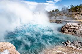 Imperial geyser sprays nearly constant jets of water into the air from a spacious pool that feeds its outlet creek. Visit Midway Geyser Basin Beyond Grand Prismatic Roads And Destinations