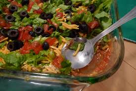· make easy guacamole, spread over bean layer: Seven Layer Dip Wikipedia