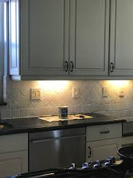 Fill in the space using the grout and allow it to dry. How I Painted My Travertine Backsplash In Three Easy Steps