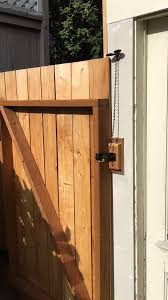 The Gate Lever Can Go Almost Anywhere Here It Is Mounted On The Side Of The House Out Of Sight Video Fence Design Wood Fence Design Wooden Garden Gate