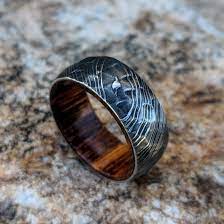 Damascus Steel Wedding Band With Ironwood Sleeve And Hammered Etsy Damascus Steel Wedding Band Steel Wedding Bands Damascus Steel Ring
