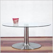 The good thing about round glass coffee tables is that they occupy little space and make small spaced rooms. Round Glass Silver Pedestal Coffee Table