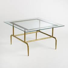 Sculptural And Simplistic Our Lorea Coffee Table Combines A Geometric Antique Brass Base With A Glass Top For A Coffee Table Pub Table Sets Glass Coffee Table