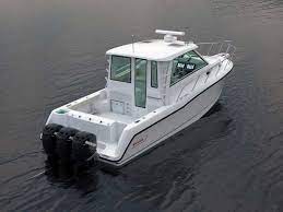Comes with 70 hp yamaha motor, boat does 33 ml/hour, new lower unit oil, also water pump kit and thermostat. Boston Whaler 345 Conquest Pilothouse Itboat Catalog