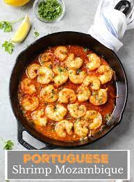 20 Minute Portuguese Shrimp Mozambique Cooked In A Spicy Garlic Butter Sauce And Served Over A Be Shrimp Mozambique Portuguese Recipes Portuguese Shrimp Recipe