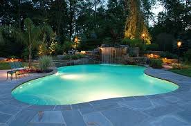 Adding A Pool Waterfall Obviously Elevates The Grandeur Of Your Backyard But It Gartenpools Schwimmbad Landschaftsbau Schwimmbader Hinterhof