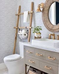 If you're always losing small metal bathroom products, such as tweezers, scissors, and toenail clippers, try installing a magnetic strip on the inside of your medicine cabinet door. 6 Over The Toilet Storage Ideas For Small Bathrooms Daily Dream Decor