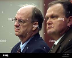 Ralph Jay Hansen, left, stands with his attorney, Barton Warren, during an  appearance before 3rd District Judge Dennis Fuchs, Monday morning, Nov. 15,  2004, in Salt Lake City. Hansen, a fired Intermountain