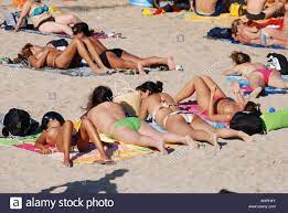 group girls public beach topless Stock Photo - Alamy