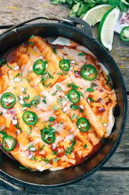 Dutch Oven Enchiladas Camping Recipe By Fresh Off The Grid Recipe Dutch Oven Camping Recipes Easy Camping Meals Oven Cooking