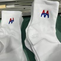 Thêu Logo lên vớ tất dệt sẵn