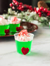 These Grinch Jello Shots Are The Perfect Way To Say Cheers To The Holidays Made With Vodka Lime Green Jello Shot Recipes Jello Shots Christmas Jello Shots