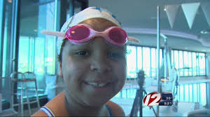 Emma McPherson gets back in the pool after a pediatric stroke