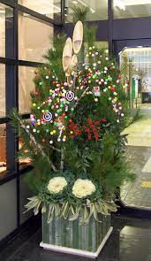Kadomatsu are traditional new year decorations made of pine and/or bamboo sprigs, placed in pairs (representing male and female) in front of homes to welcome the shinto gods. Japanese New Year Wikipedia