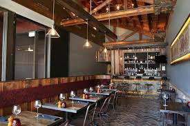 Even though the appliances are modern, the aesthetic reads as older and rural. Salvaged Wood Metal Chairs Rustic Restaurant Rustic House Contemporary Rustic Decor