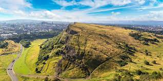 One of them, called arthur's seat, the centrepiece of the royal park, has an elevation of 823 feet (251 metres) and dominates the city's southeastern flank. Arthurs Seat In Holyrood Park Edinburgh Seat