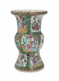 Maybe you would like to learn more about one of these? A Chinese Export Canton Famille Rose Shaped Beaker Vase