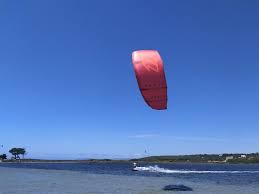 Kiteboarding many times said kitesurfing, is an extreme sport where the kiteboarder harnesses the power of the wind with a large controllable power kite (wing) to be propelled across the water, land. Blog For Kitesurfing In Sardinia Enjoy Kitesurfing Sardinia