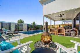 Landscaping To Transform Your Swimming Pool Area Narellan Pools Canada Around the pool string lighting.