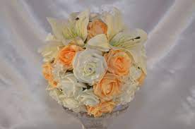 This beauty by tiger lily weddings, with its soft pink orchids and full garden roses, should do the trick! Adult Bridesmaid Ivory Mango Rose Artificial Wedding Bouquet With Ivory Tiger Bouquets By Design