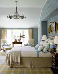 Window panels, valances, and tiebacks outfit two windows, while the collection of throw pillows and shams adds a luxurious look. Traditional Bedroom Design Master Interpretations Dk Decor