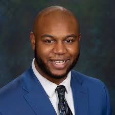 His colleagues describe him as a “game show host trapped in a professor's  body.”