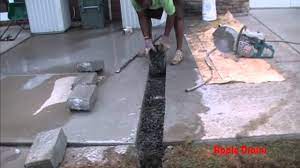 French drains provide an easy channel for water to flow through. Downspout Drain Under Concrete How To Cut Remove Concrete Youtube