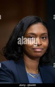 Natasha C. Merle appears before a Senate Committee