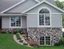 River rock veneer panels will enhance any project with their natural finishes and realistic texture. Wisconsin River Rock Applied To A Home Love The Look Of The Veneer Vinyl Siding Together Stone Siding Exterior Stone Veneer Exterior Houses Rock Siding