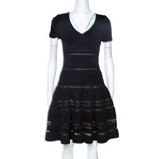 Add this tried and true style to your closet today! Alaia Black Textured Pointelle Knit Fit And Flare Dress M Alaia Tlc