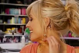 tami showing the cameras her new tattoo