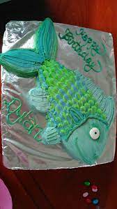 With an icing filled bag and round tip, size #5, draw the fish (in this case it is flounder from the little mermaid) on the cake top. Simple Fish Shaped Cake Fish Cake Birthday Fish Cake Birthday Cake Kids