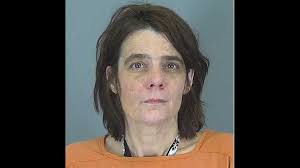 5 dogs attack woman attending funeral; owner arrested, officers say