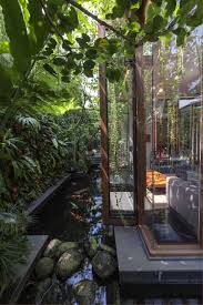 Natural Home Design Concept For Harmony Living Garden Decor With Small Natural Look Fish Pool And Glass Window Home De House In Nature Garden Villa Pond Design
