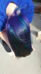 If you're on the hunt for the perfect blue hair dye for dark hair, try indigo blue with purple undertones. Underneath Brown Hair With Purple And Blue Hidden Hair Color Purple Brown Hair Underlights Hair