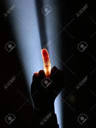 Dark Silhouette Of Human Male Hand With Raised Middle Finger In Spotlight  Or Backlight Light With Gesture On Black Background With Dramatic Projector  Shine Ray Or Beam Stock Photo, Picture and Royalty