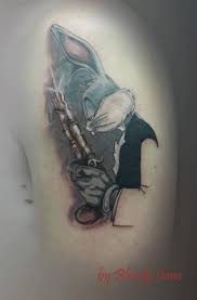 Bugs bunny tattoo featuring sylvester and daffy. Shoulder Gun Bugs Bunny Tattoo By Bloody Blue Tattoo